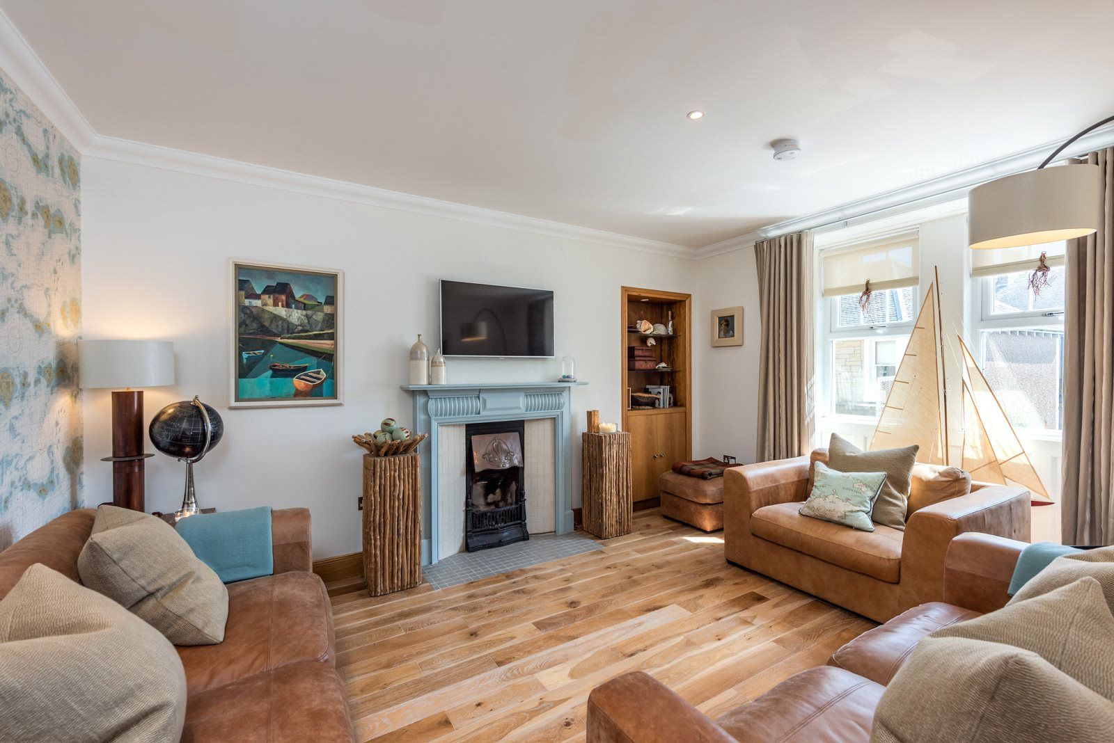 A vibrant living room with sofas, chairs and a fireplace