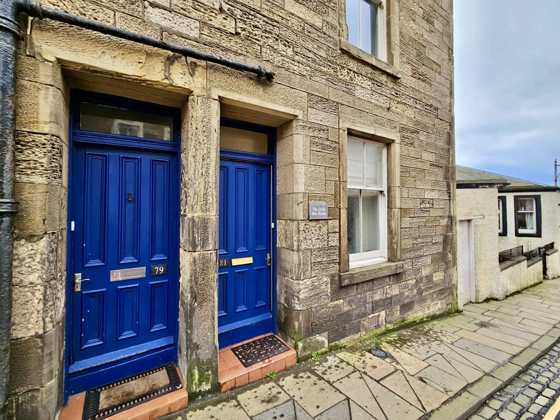 Stone houses with bright blue doors