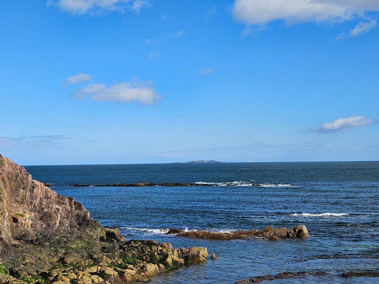 A rocky coastline on a sunny day