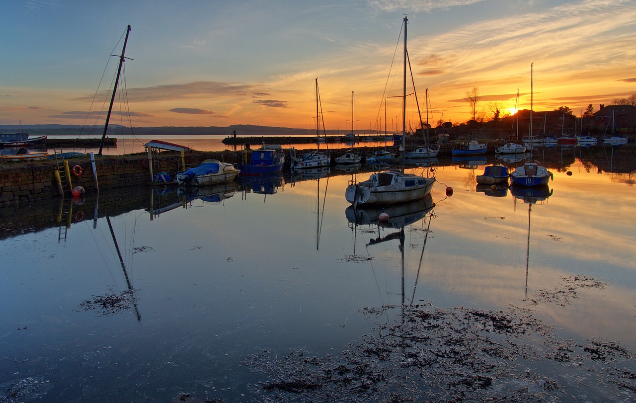 Boats in a port in sunset