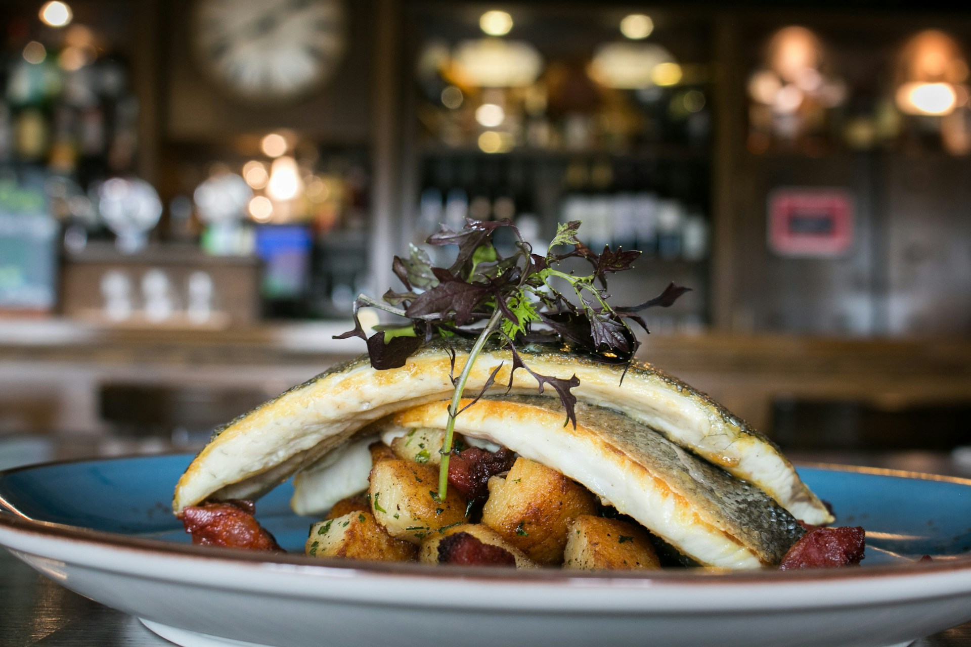 Baked fish on a plate with vegetables