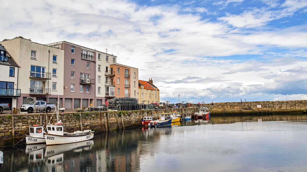 Different coloured houses overlooking a harbour