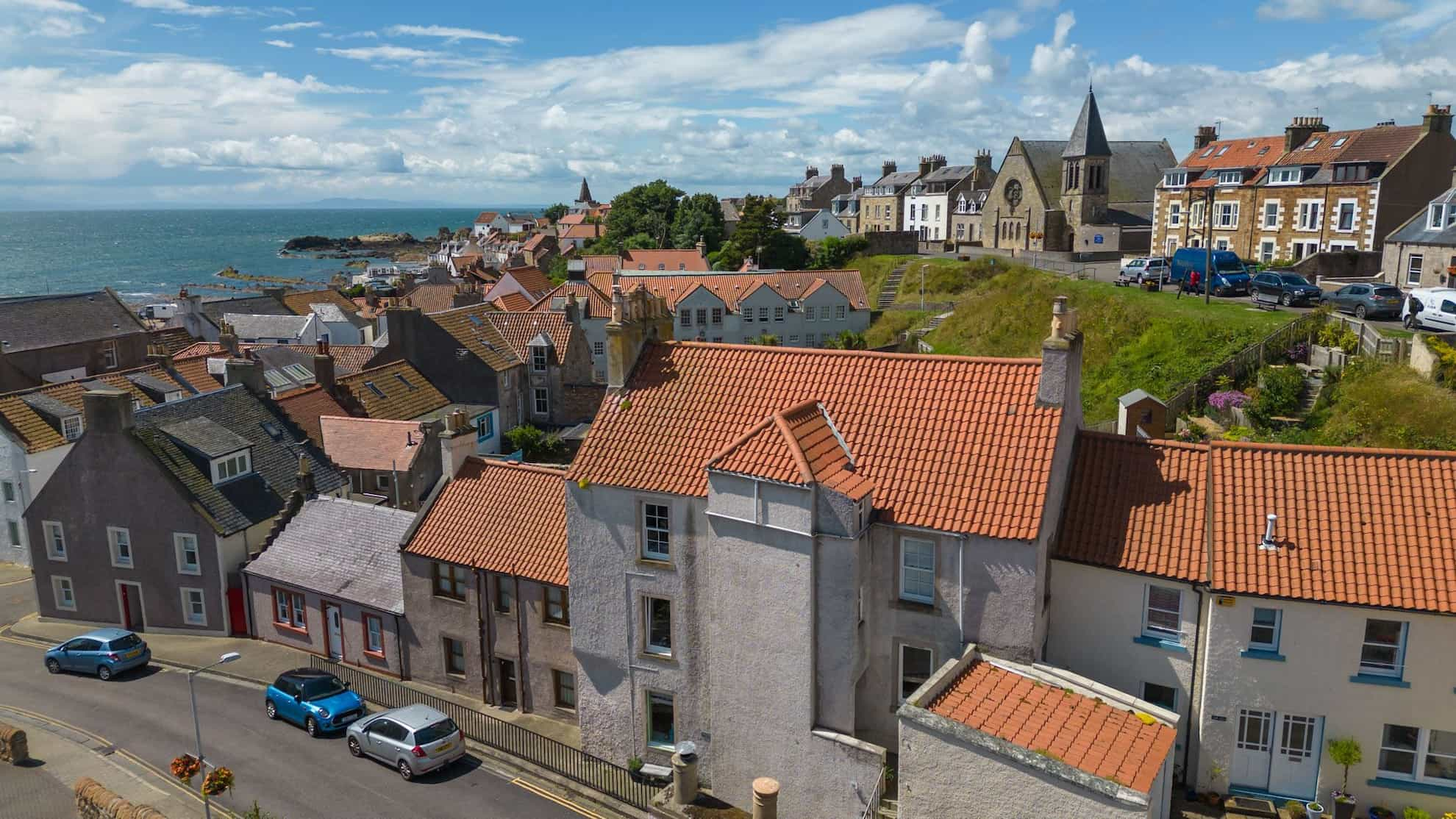 Rows of houses on a street with terracotta rooves