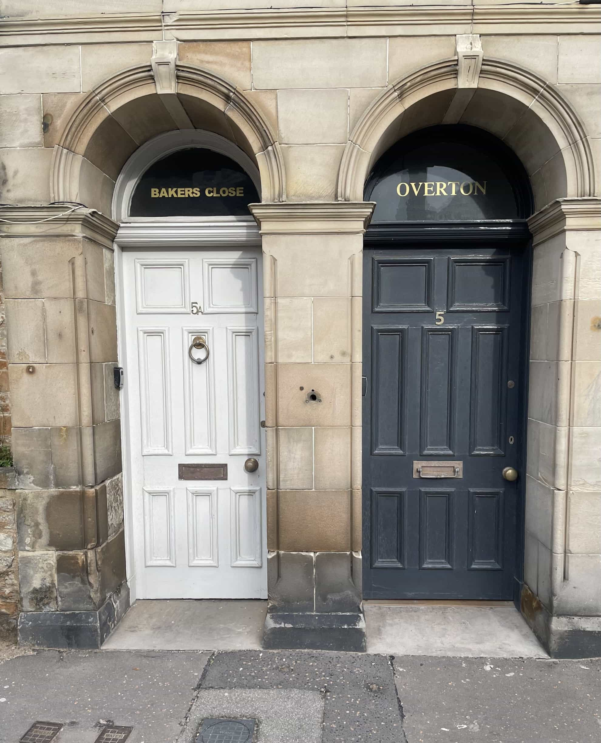 Two doors set into a stone wall