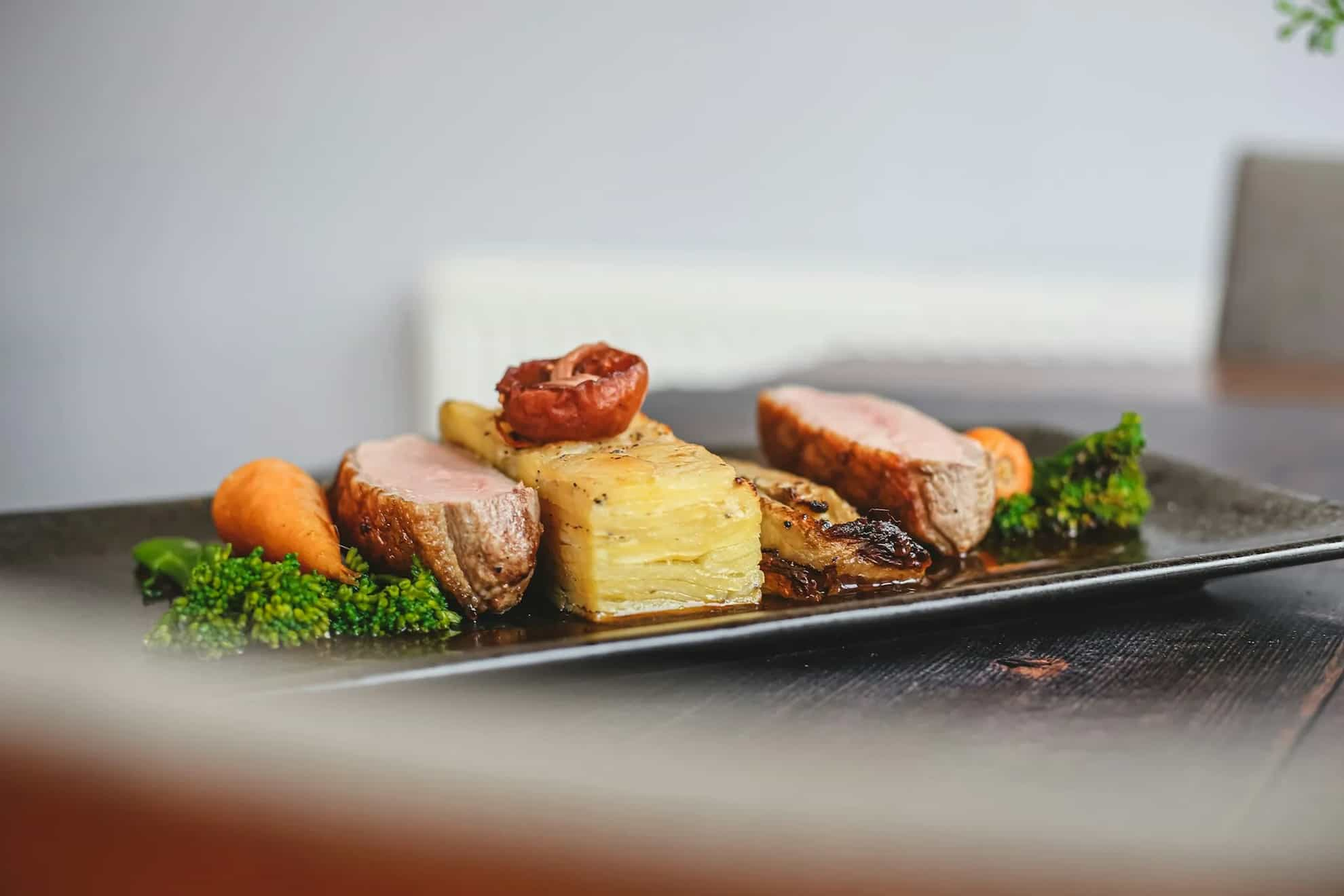 Food items on a long dark tray